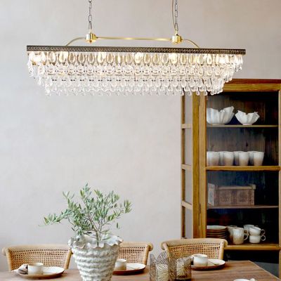 Multi-tier chandelier with cascading clear glass prisms in a classic Versailles-inspired design.