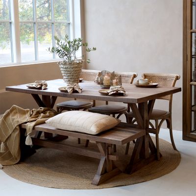 Rectangular wooden dining table with a classic, elegant design, offering a spacious surface for family meals and entertaining