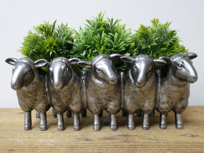 Baasil Sheep Planter.  Row of Silver finish Sheep creating an indoor planter.