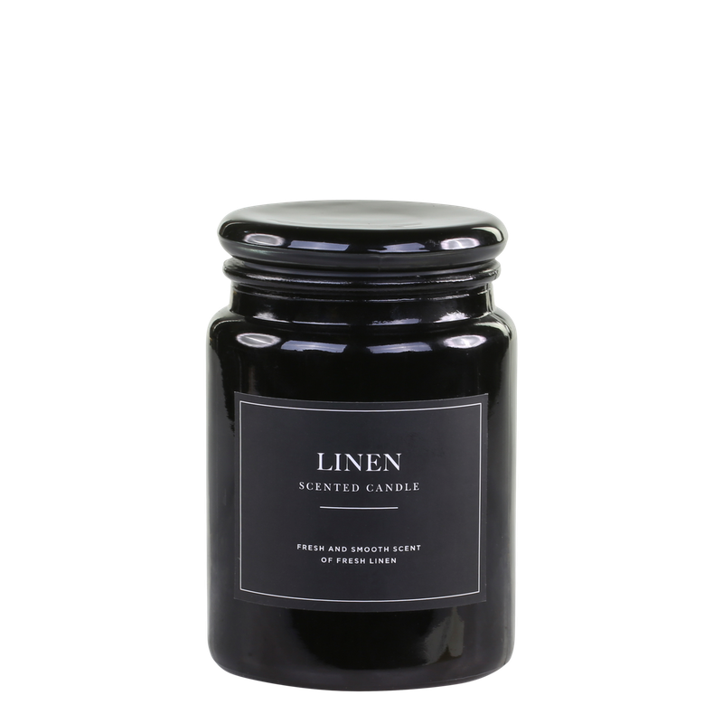 Lucon Scented Candle - Linen - White Candle in Dark Glass Container.  Black Label with White Writing.