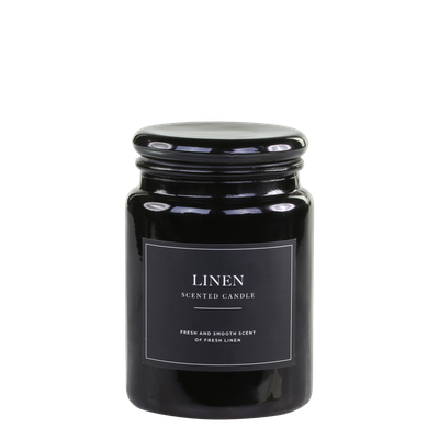 Lucon Scented Candle - Linen - White Candle in Dark Glass Container.  Black Label with White Writing.