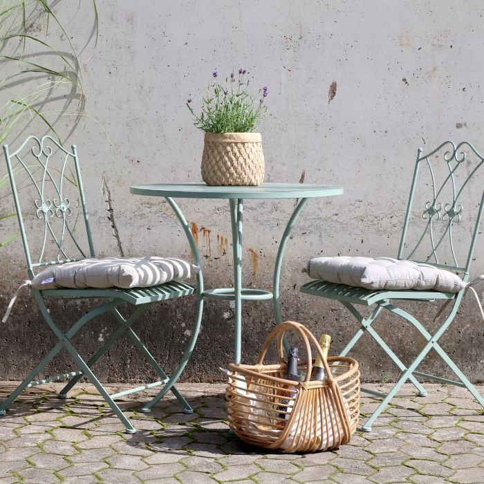 Florence Bistro Set in Antique Verte with a round slatted table and two folding chairs featuring decorative backrests