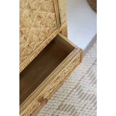 Natural rattan bedside cabinet with cupboard and two drawers, woven detail, slim legs and round wooden handles.
