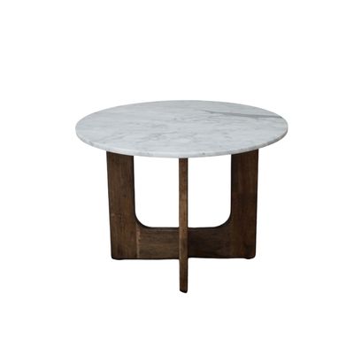 Round marble top side table with a warm wooden base, featuring curved cut-out legs and a simple, balanced design