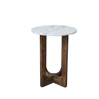 Round marble top side table with sculptural wooden base, tall and slender with warm wood tones and a simple, elegant form