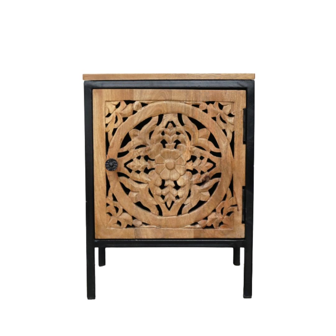 Hand-carved wooden bedside cabinet with floral door design, natural wood finish and black frame.