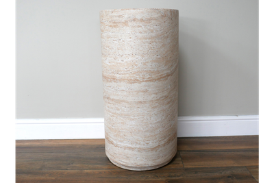 Stone-effect column pedestal with a travertine-style finish, ideal for displaying plants, sculptures or décor accents.