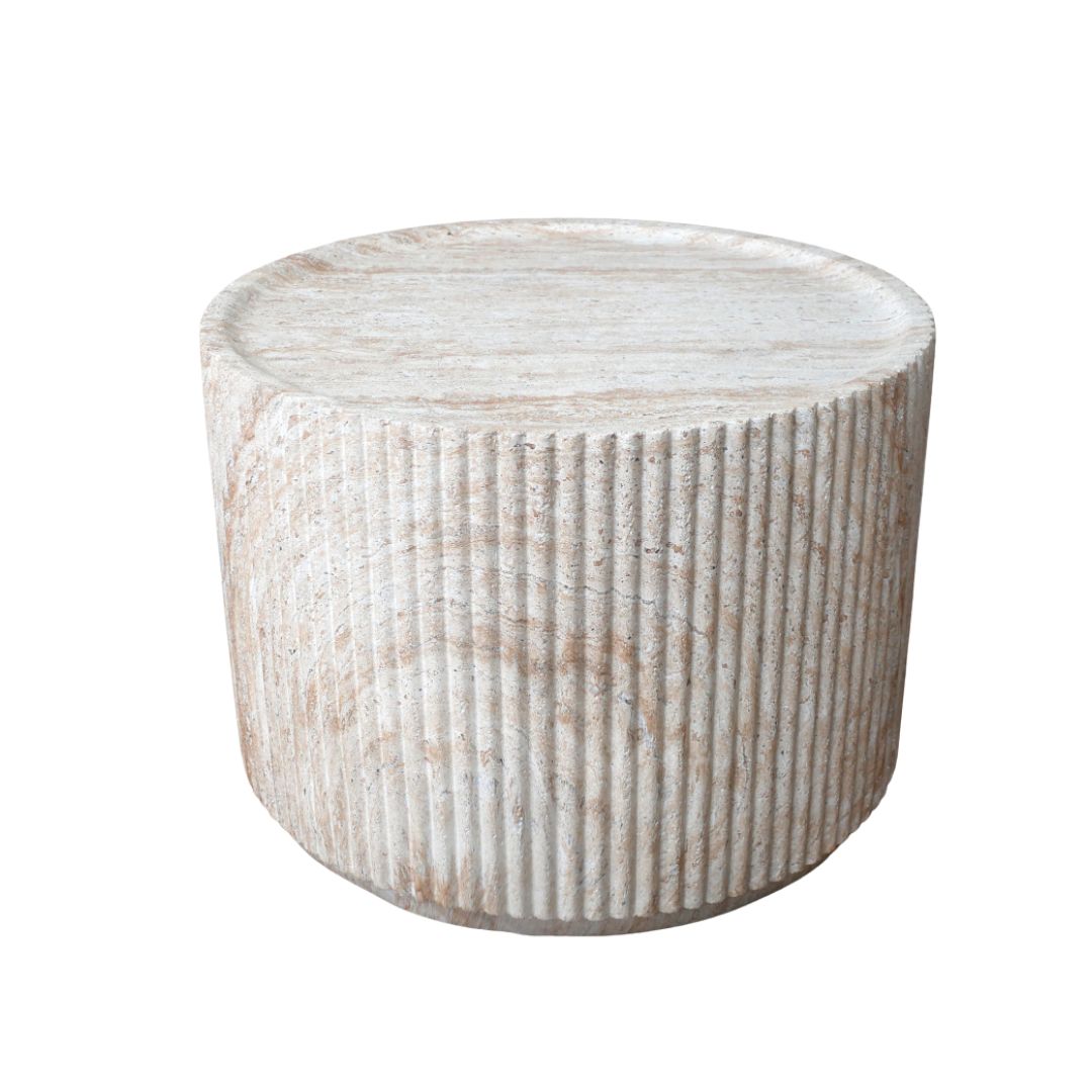 Round stone-effect coffee table with ribbed detailing, natural textured finish and a contemporary sculptural design.