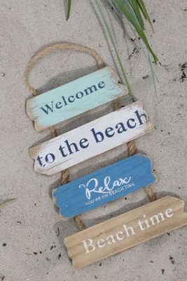 Rustic hanging beach sign with blue and natural wooden slats reading Welcome to the beach, Relax, and Beach time.