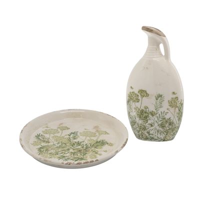 Cream ceramic jug and matching tray with delicate green botanical design and distressed finish for rustic décor.