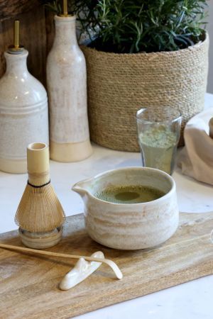 Japanese matcha tea set with handcrafted ceramic bowl, bamboo whisk, scoop and whisk holder for an authentic tea ritual.