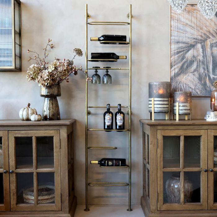 Tall metal wine rack with an aged finish, featuring horizontal bottle holders in a slim, space-saving vertical design.