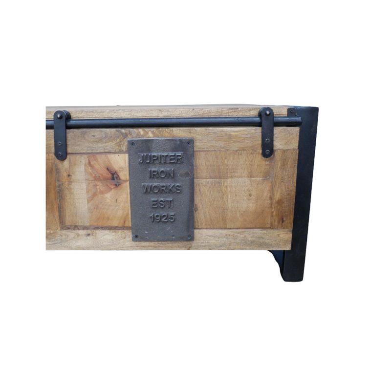 Iron Works Coffee Table in weathered wood and black metal, with open storage and a sliding panel door.