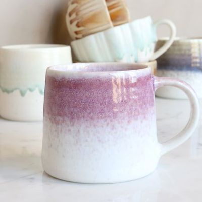 Heather Blush: Ceramic mug with a softly rounded shape, curved handle and reactive dusky-mauve glaze fading into speckled.