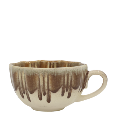 Slow Morning Cup in Toffee Melt, featuring a cream ceramic base, warm caramel-brown dripping glaze, ribbed texture, uneven ri