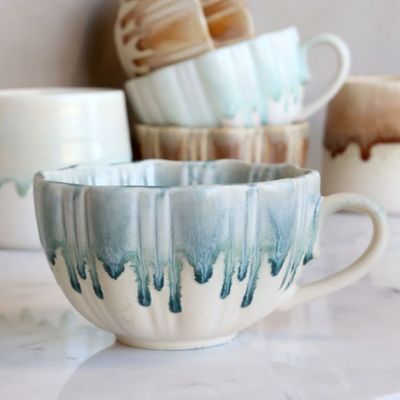 Stormy Sage: Slow Morning Cup in Stormy Sage, featuring a cream ceramic base, deep blue-green dripping glaze, ribbed texture,