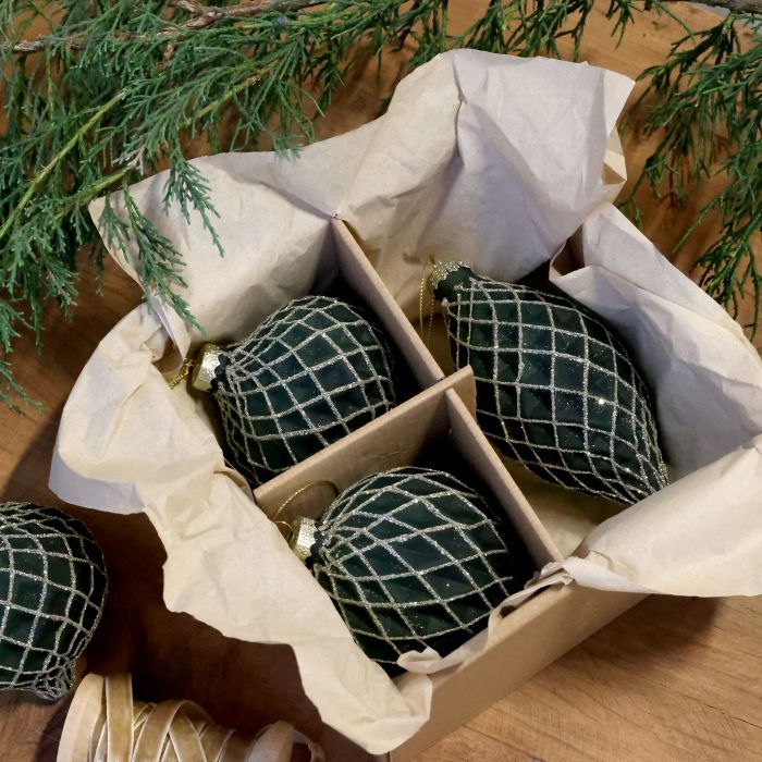 Boxed set of three dark green Christmas baubles in assorted shapes, decorated with a sparkling silver trellis pattern.