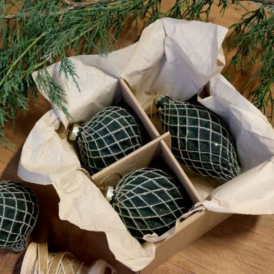 Boxed set of three dark green Christmas baubles in assorted shapes, decorated with a sparkling silver trellis pattern.