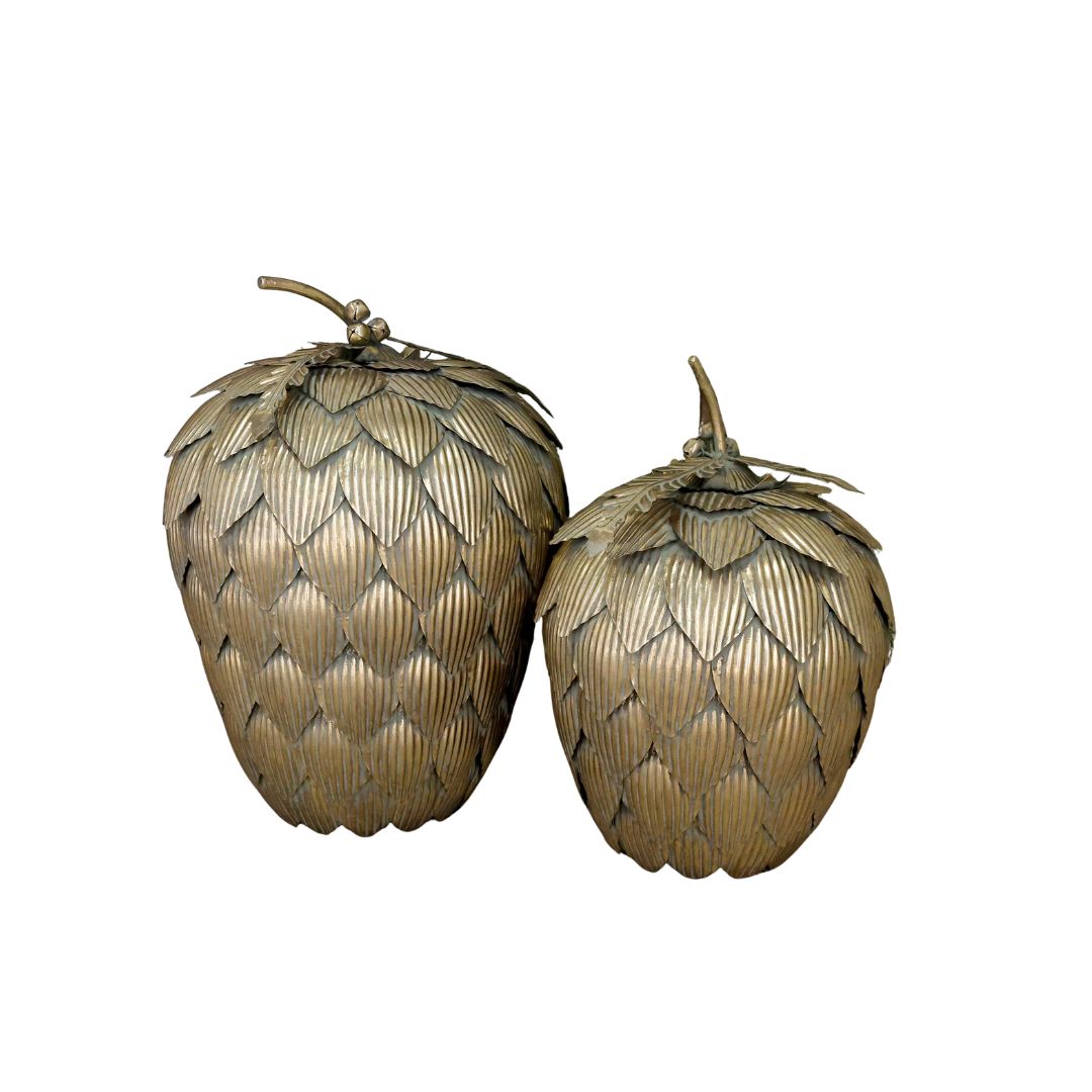Gilded Artichoke Christmas Decorations – Set of Two Two large gilded artichoke Christmas decorations with layered ribbed leaves, displayed beside a frosted evergreen tree.