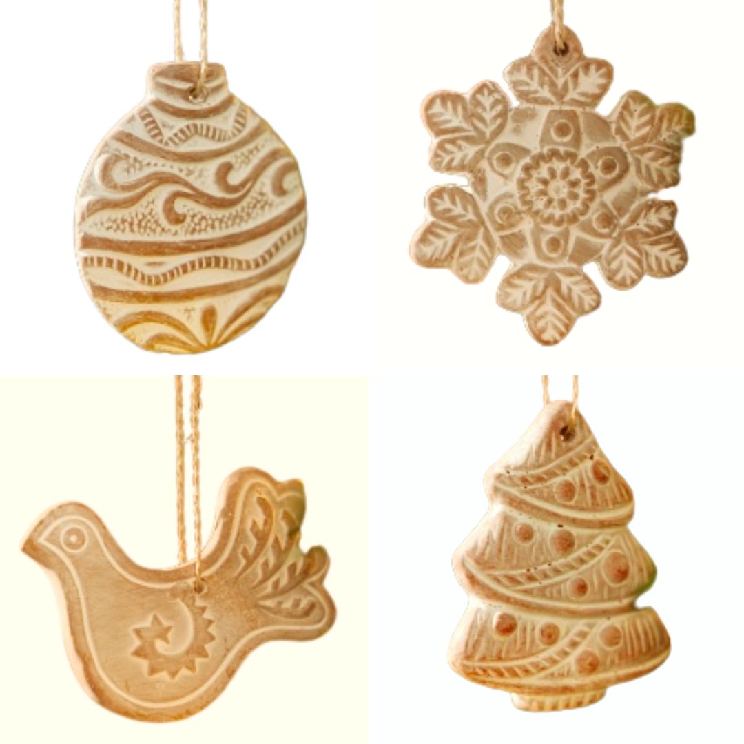 Fair Trade Folk Terracotta Christmas Decorations – Set of Four Four terracotta Christmas decorations shaped as a bauble, snowflake, dove and tree, with whitewashed carved patterns.