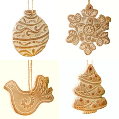 Fair Trade Folk Terracotta Christmas Decorations – Set of Four Four terracotta Christmas decorations shaped as a bauble, snowflake, dove and tree, with whitewashed carved patterns.
