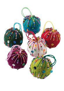 Jewel Garden Embroidered Felt Baubles – Set of Six Six colourful handmade felt baubles decorated with embroidered lines, beads and sequins, each with a hanging loop.