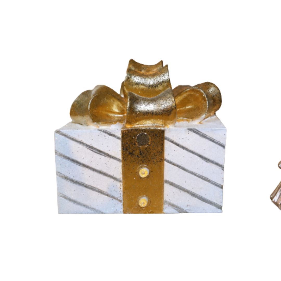 Golden Bow Light-Up White Christmas Present Decoration (Set of Six) White light-up Christmas present with diagonal silver stripes, a gold ribbon and an oversized glittering bow.