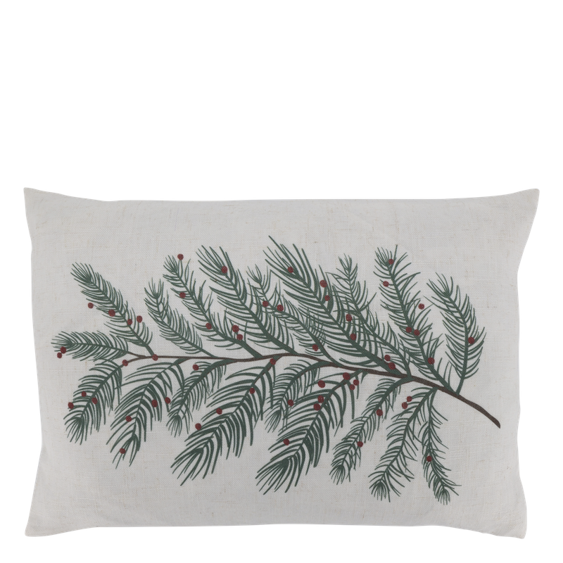 Natural rectangular cushion printed with a sweeping dark green evergreen branch and scattered red winter berries.
