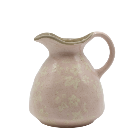 A rounded blush-pink ceramic jug with a curved handle, pouring lip & mottled glaze revealing a faint ivy pattern Jug