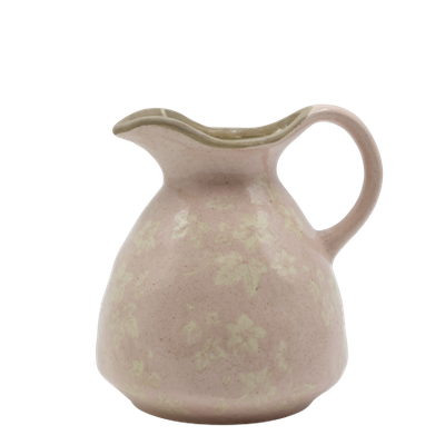 A rounded blush-pink ceramic jug with a curved handle, pouring lip & mottled glaze revealing a faint ivy pattern Jug