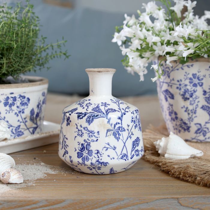 Delicate indigo flowers and winding foliage inspired by the quiet beauty of country hedgerows ceramic Vase