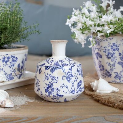 Delicate indigo flowers and winding foliage inspired by the quiet beauty of country hedgerows ceramic Vase
