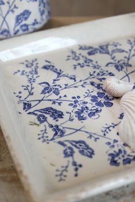 Delicate indigo flowers and winding foliage inspired by the quiet beauty of country hedgerows ceramic tray