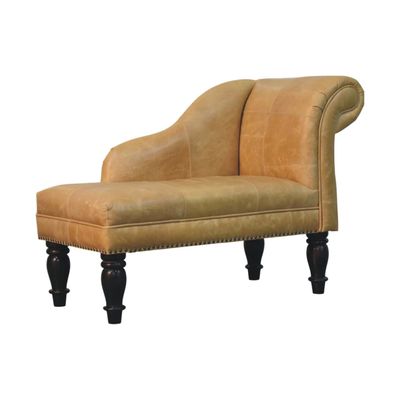 Gracefully curved tan leather chaise with traditional stud detailing, turned wooden legs and timeless country-house charm.
