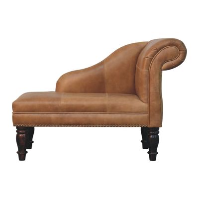 Gracefully curved brown leather chaise with traditional stud detailing, turned wooden legs and timeless country-house charm.