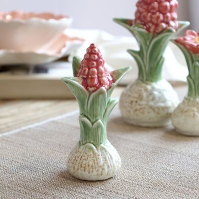 Ceramic Botanical Hyacinth Bulb ornament with textured cream bulb, green leaves and delicate raspberry flowers.