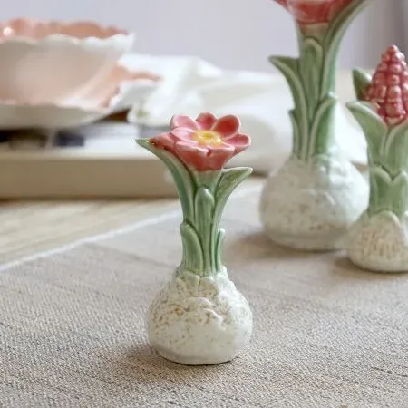 Ceramic Botanical Coral Bloom ornament with textured cream bulb, green leaves and a coral-red flower with yellow centre.