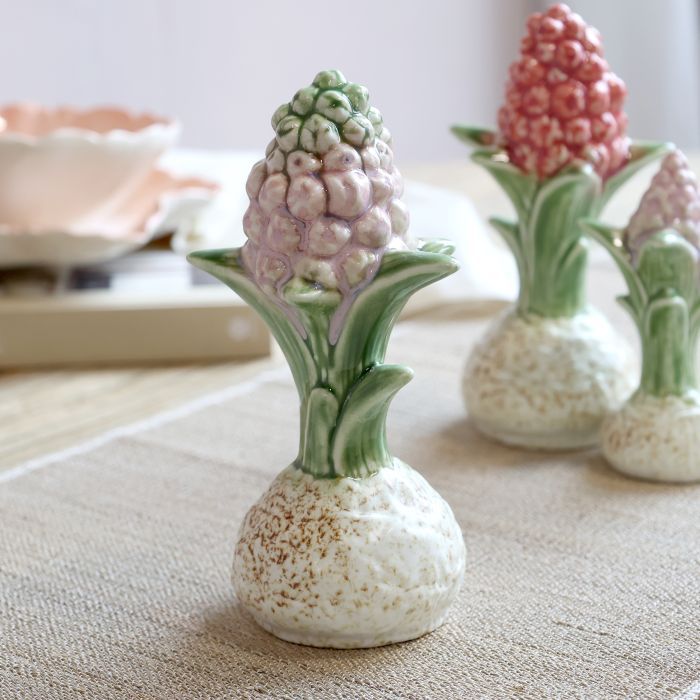 Ceramic Botanical Hyacinth Bulb ornament with textured cream bulb, green leaves and delicate lavender flowers.