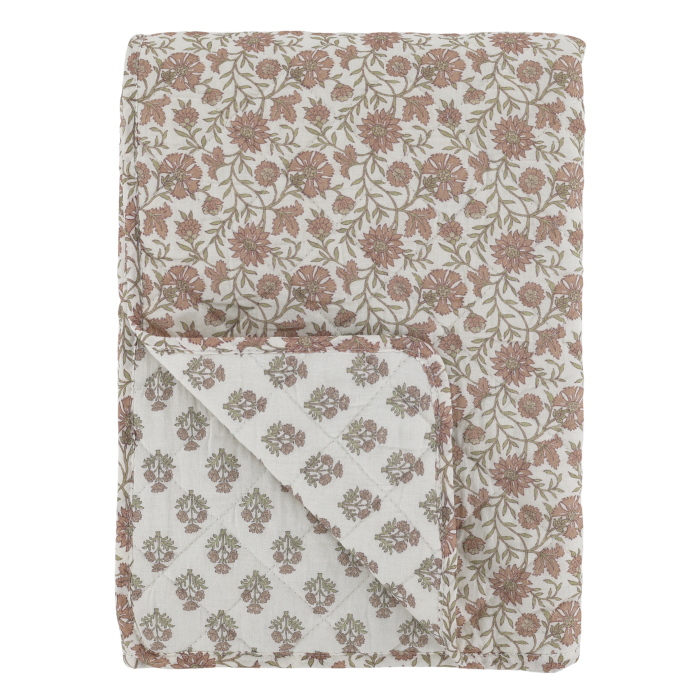 Reversible floral quilt in soft mocca tones on a melon background, with delicate sprig pattern and quilted stitching.