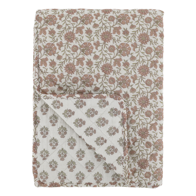 Reversible floral quilt in soft mocca tones on a melon background, with delicate sprig pattern and quilted stitching.