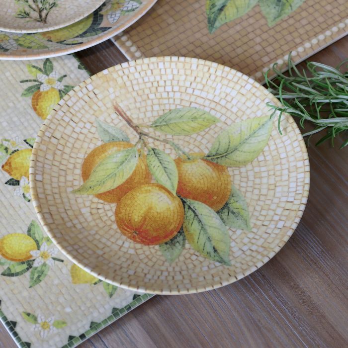 Round Chartres mosaic tray with golden oranges, sage green leaves and concentric honey, cream and ivory tiles.