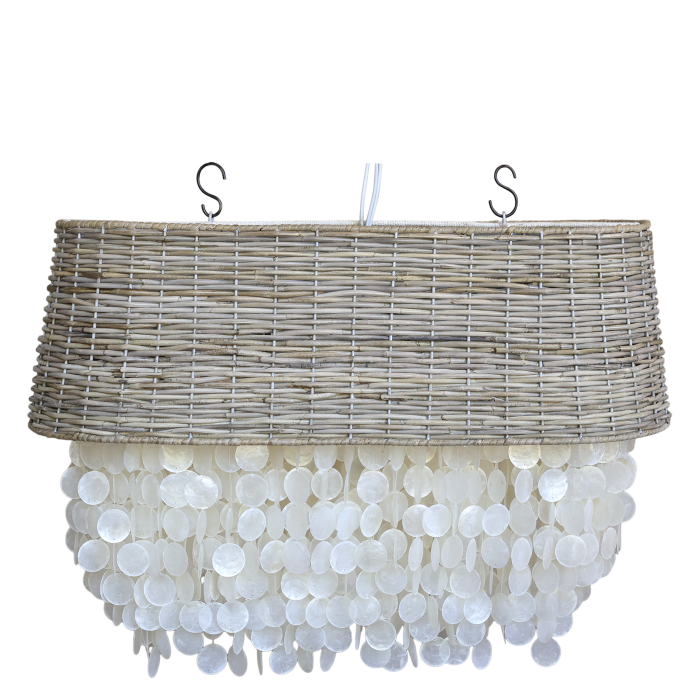 Coastal chandelier with a natural woven rattan drum shade and cascading layers of pearly white seashell discs.