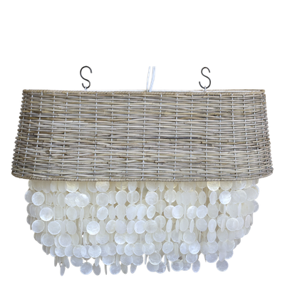 Coastal chandelier with a natural woven rattan drum shade and cascading layers of pearly white seashell discs.