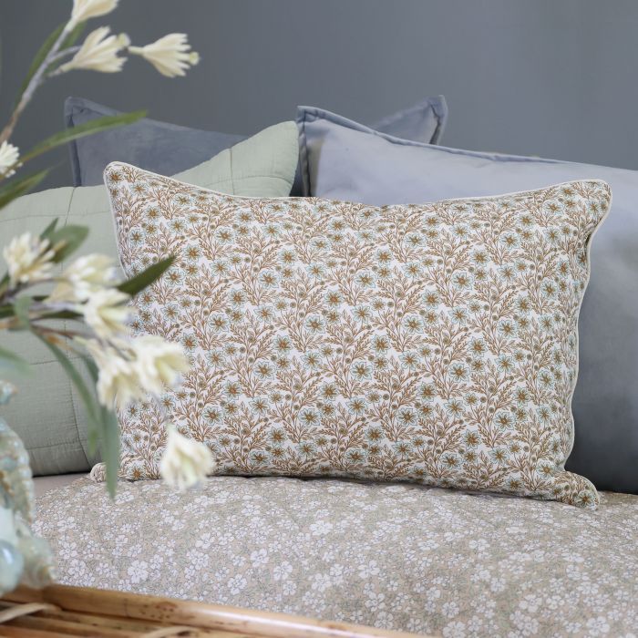 Rectangular ivory cushion with delicate sky blue flowers, intricate mocca foliage and a traditional botanical pattern.