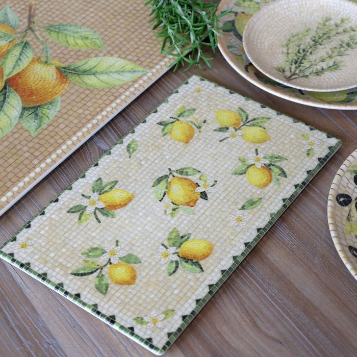 Rectangular Chartres mosaic tray with yellow lemons, white citrus blossoms, green leaves and a cream tiled background.
