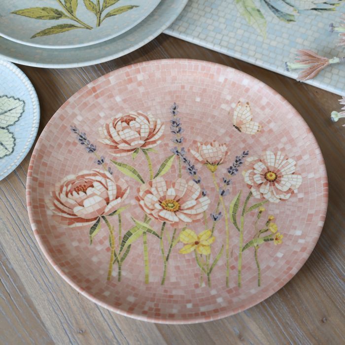 Round Chartres mosaic tray with pink and cream flowers, lavender sprigs, a butterfly and warm blush pink tiled background.