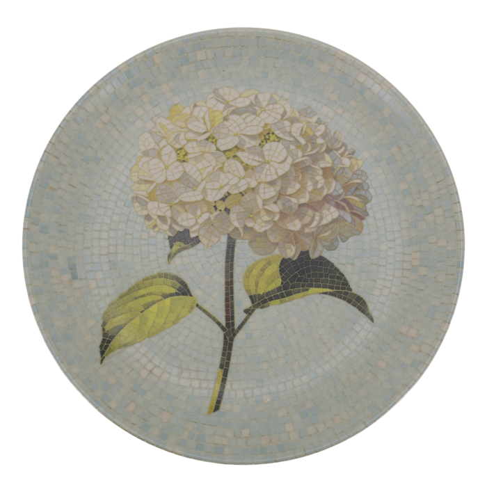 Round Chartres mosaic tray with an ivory hydrangea flower, green leaves and delicate pale blue and cream tiled background.