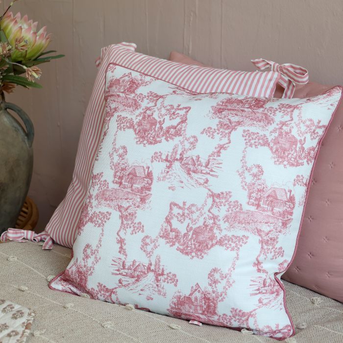 Chic Etoile cushion in ivory with a delicate rose pink French toile countryside pattern and matching piped edges.