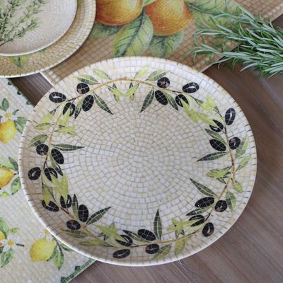 Round Chartres mosaic tray with a border of green olive branches, black olives and concentric cream and ivory tiles.