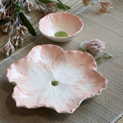 Blush pink ceramic flower bowl with rippled petals, delicate raised stamens, creamy white centre and green heart.